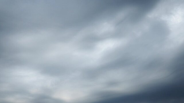Beautiful white and dark storm clouds in blue sky. Volumetric effect. Convection in troposphere. Time-lapse. Cumulus clouds low-level, puffy, cotton-like. Fluffy Cumulonimbus. Rainy terrible clouds
