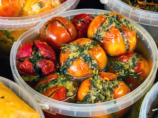 Marinated tomatoes stuffed with herbs