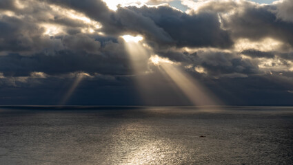 sunbeams over south stack lighthouse Angelsey