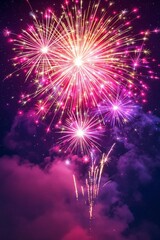Fototapeta premium Vibrant Night Sky Display of Colorful Fireworks with Cloudy Background
