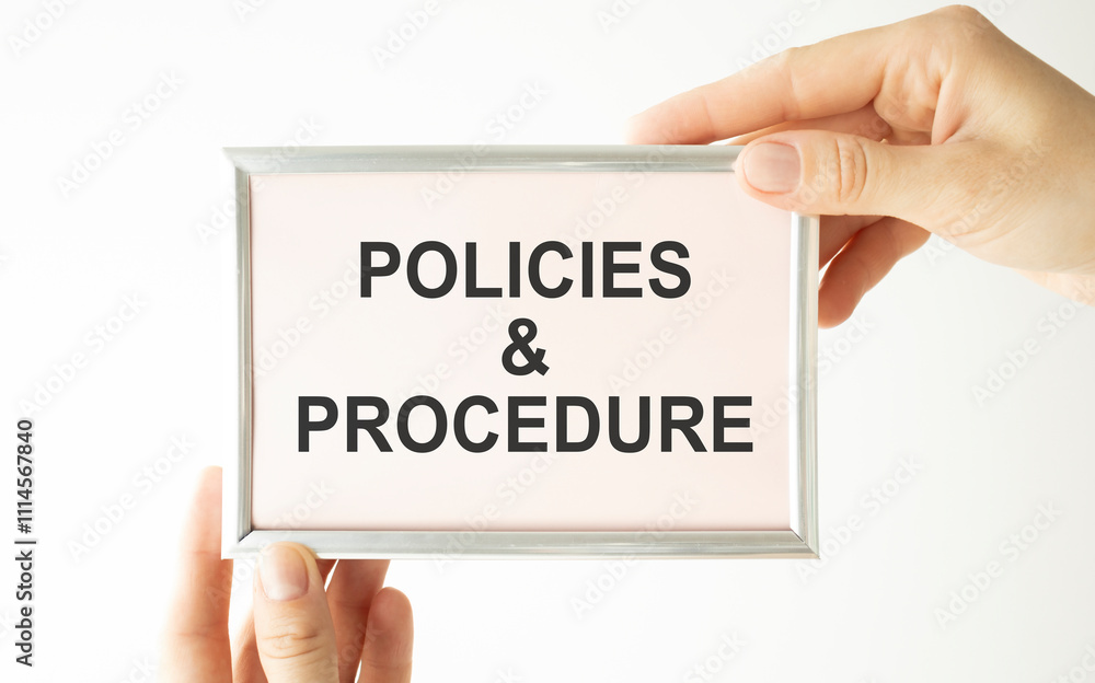 Poster policies and procedures text written on a notebook