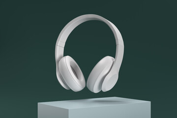A pair of white headphones are suspended in midair
