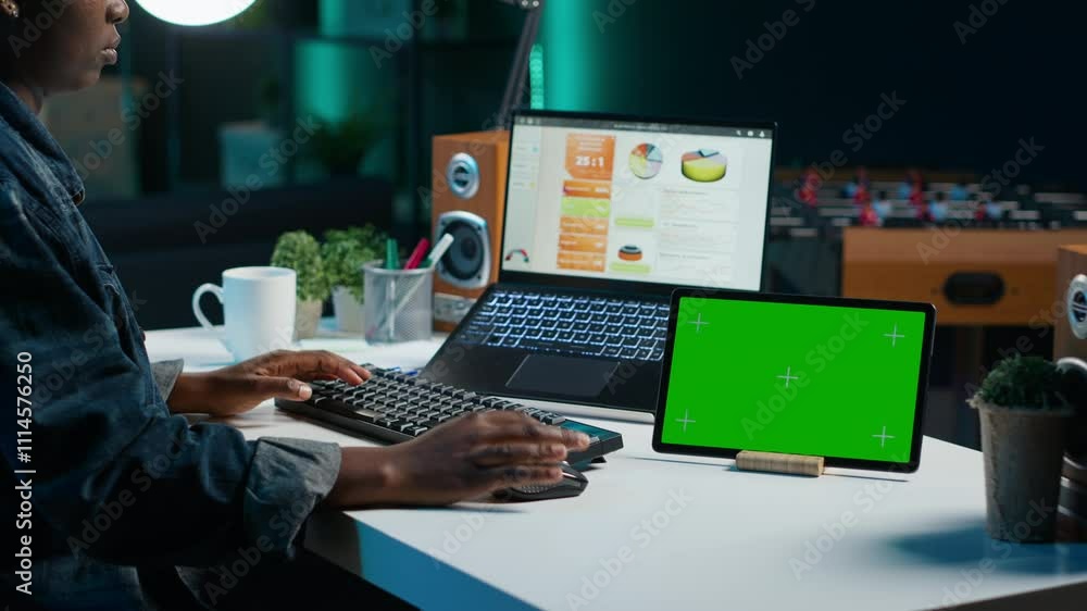 Poster entrepreneur working from home, using green screen device to write notes. remote worker in personal 