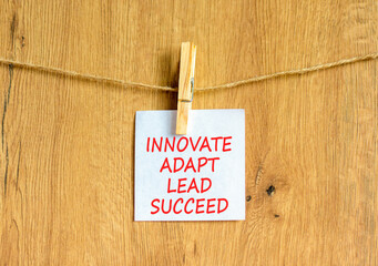 Innovate adapt lead succeed symbol. Concept words Innovate Adapt Lead Succeed on beautiful white...