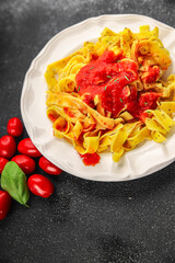 Pasta tagliatelle tomato sauce second course tasty food dish fresh delicious gourmet food background on the table rustic food top view copy space