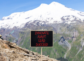 Innovate adapt lead succeed symbol. Concept words Innovate Adapt Lead Succeed on beautiful black...