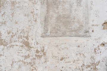 Texture and structure of old house wall, as a background. Paint is chipping off at many places, and...