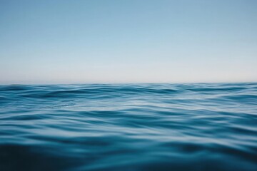 Fototapeta premium Serene Ocean Waves Under A Clear Blue Sky