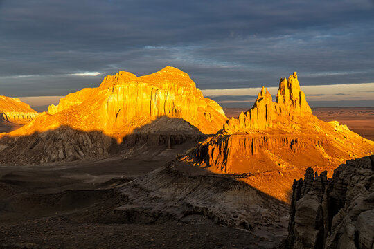 Kazakhstan, Mangistau, Mangyshlak, Airakty. Beautiful jagged mountain with numerous peaks at dawn under a crimson sky. Drone view