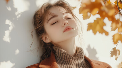 Fototapeta premium Generative AI image from below of young model in autumn fashion outfits with eyes closed while standing next to a white wall