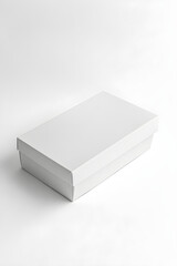Fototapeta premium Minimalist White Rectangular Shoe Box on White Background with Matte Finish for Footwear Storage and Gifting
