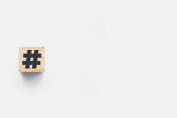 # (hashtag) wooden cube on white background