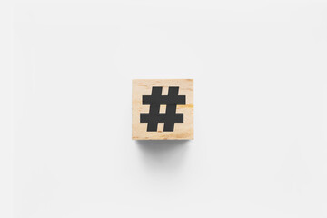# (hashtag) wooden cube on white background