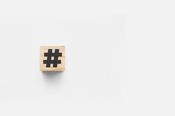 # (hashtag) wooden cube on white background