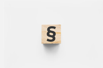 &sect; (Section Sign) wooden cube on white background