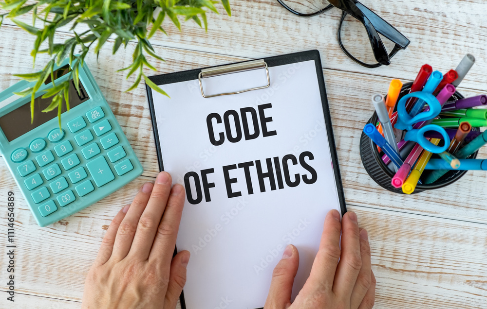 Poster code of conduct text on notebook. concept of ethical integrity, value and ethics.