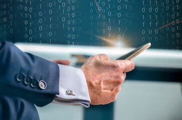 close up businessman hand touch screen on digital tablet to use marketing tool and check traffic...