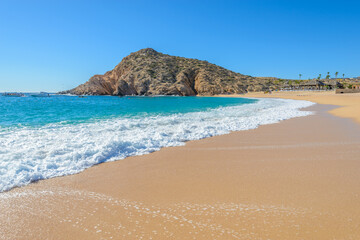 Santa Maria Beach, Cabo San Lucas, Mexico. Different stages of the fantastic ocean waves. Rocky and sandy beach.