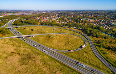 Fototapeta premium Aerial view of beltway route south and east highways Biezanow transportation hub in Kokotow district of Cracow in Poland