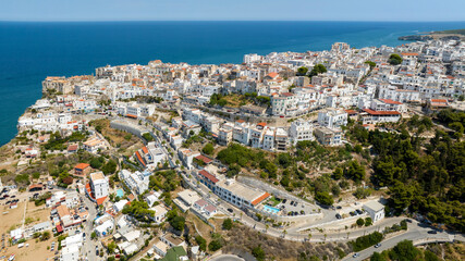 Fototapeta premium Aerial view of the historic center of Peschici, a town in the province of Foggia, Puglia, Italy. It is a tourist destination in Gargano overlooking the Adriatic Sea.