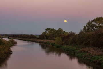 moonrise  over river witham in sumer