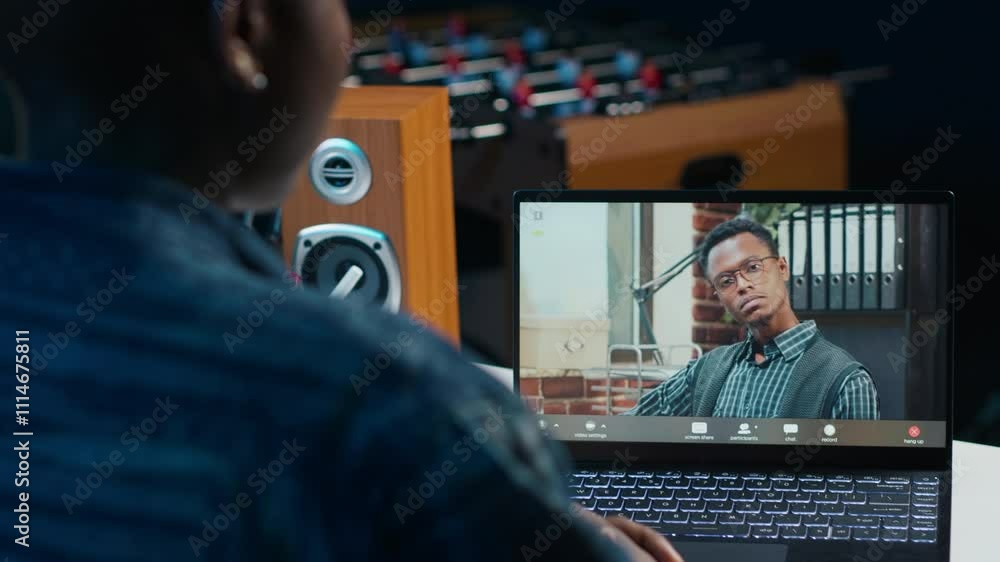 Poster remote employee calls manager remotely using internet videocall to ask for feedback on project progr