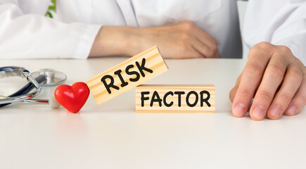 Text risk factors from wooden blocks with stethoscope
