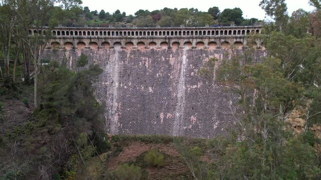 Dry Conde De Guadalhorce Dam Surrounded by Vibrant and Lush Greenery in Andalusia Spain