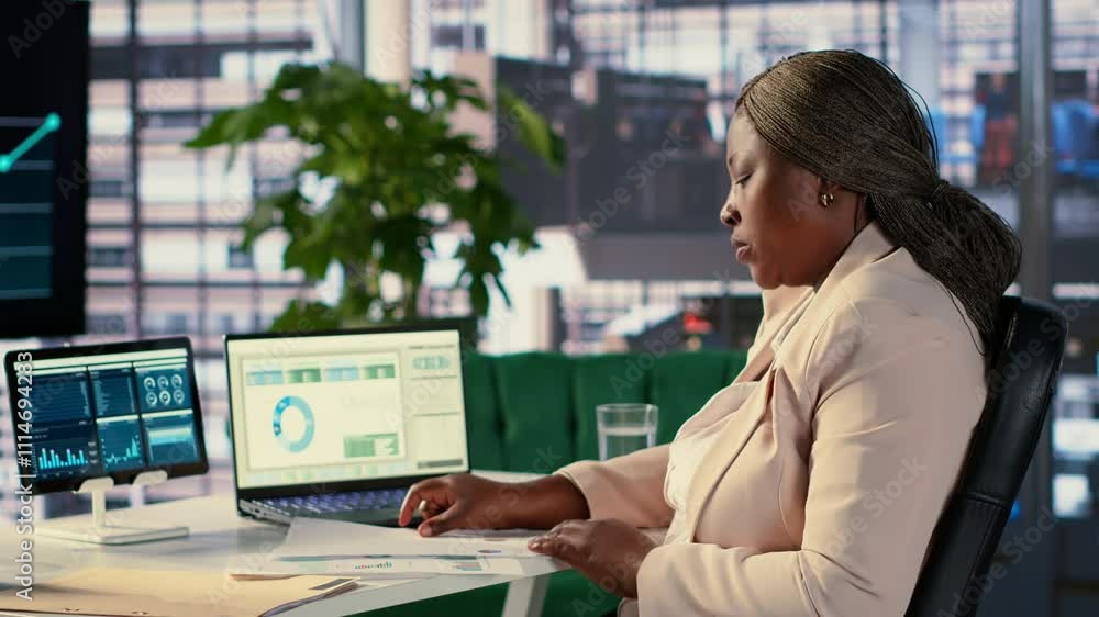 Poster black influential businesswoman evaluates company performance, using data reports and analytics to m