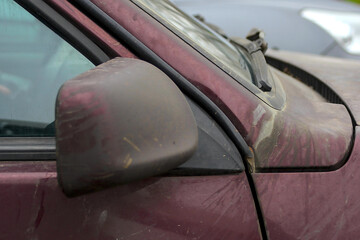 a fragment of an old, dirty car