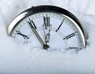 Analog Clock Partially Submerged in Snow