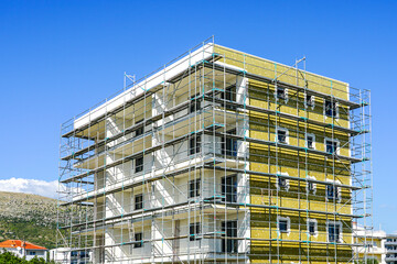 Thermal insulation works of the facade of a apartment building with mineral wool plates