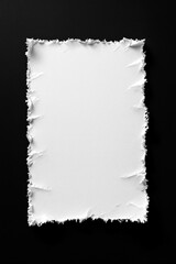Obraz premium Textured Torn White Paper Sheet on Black Background
