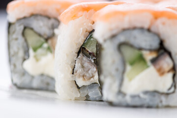 Sushi set and composition at white background. Japanese food restaurant, sushi maki gunkan roll plate or platter set.