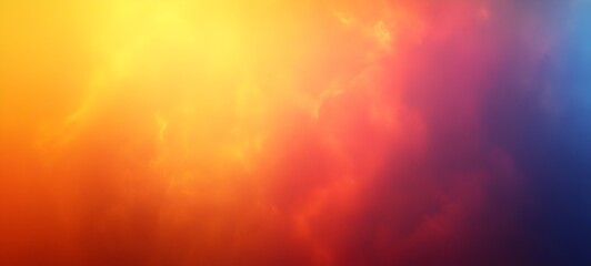 Obraz premium A stunning abstract background showcasing a gradient of vibrant colors transitioning from warm oranges and yellows to cool blues, evoking feelings of warmth and serenity.