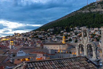 Panoramic view of Dubrovnik from the city walls at sunset. Spectacular the church bell belfry with its three bells. Dubrovnik, Croatia