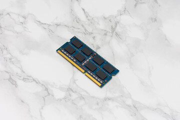 Blue computer RAM Sticks sits on a white countertop
