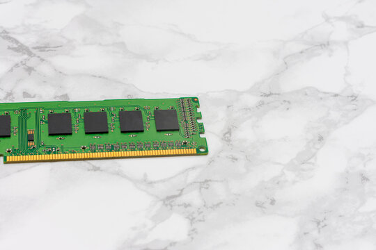 Green computer RAM Sticks sits on a white countertop