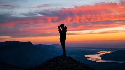 Fototapeta premium adventurer watching a vibrant sunset from a mountaintop symbolizing personal growth and exploration