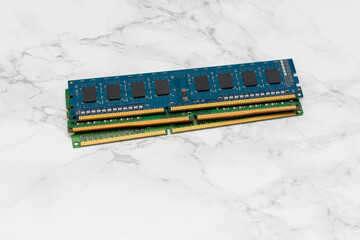 Three RAM Sticks on a White Surface