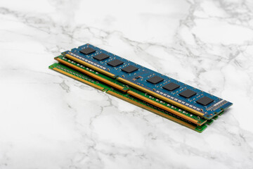 Three RAM Sticks on a White Surface