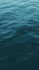 Obraz premium Deep blue ocean water surface creating a mesmerizing texture, with gentle waves rippling across, evoking a sense of tranquility and vastness in the serene marine landscape