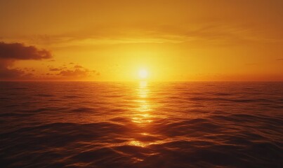 Fototapeta premium A hazy and grainy gradient of warm oranges and yellows sink into a serene and textured ocean capturing the essence of a tranquil sunset.