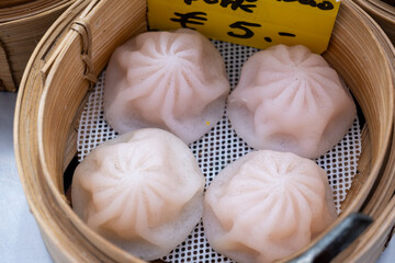 Asian food, steamed cooked filled gyoza dumplings in street cafe ready to eat