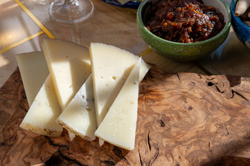 Sherry wine and food pairing, Spanish matured cheese and onion chutney close up