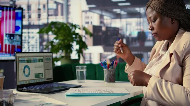 General director signing work contracts and approving employees requests, doing daily paperwork tasks for productivity. Black CEO gives authorization for leave request or license agreement. Camera B.