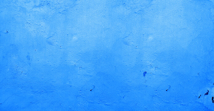 light blue wall texture background .Abstract Wide Angle light blue stucco Background. Wall building Close up. Rough Surface plaster Texture With Copy Space for design . Blue cement wall cladding tex
