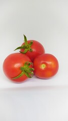 Delicious Fresh Organic Tomatoes Placed on a Bright White Background with Excellent Lighting