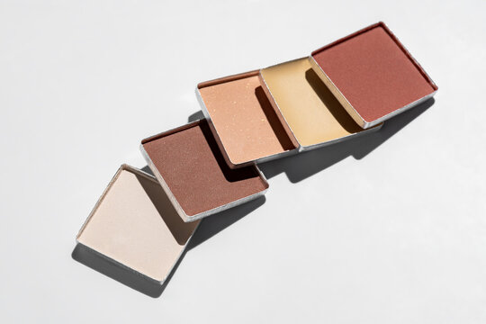 Minimalist makeup palette with varied earthy shades