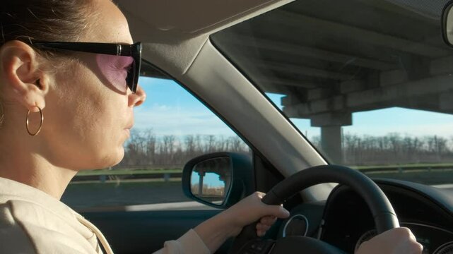 Female driver have tour. A female have a country tour on her rental car during day time.